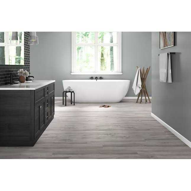 Style Selections Charleston Oak 12-mil x 7-in W x 48-in L Waterproof Interlocking Luxury Vinyl Plank Flooring LWD6909SS - Image 4